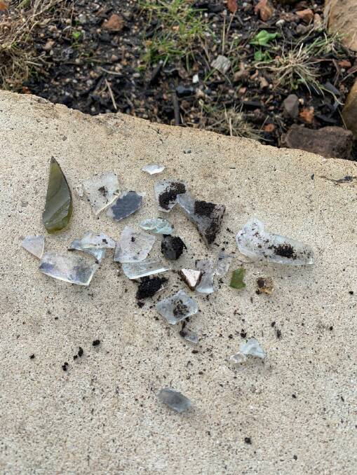 Shards of glass discovered in a batch of FOGO compost by a Tura resident. Photo: Supplied