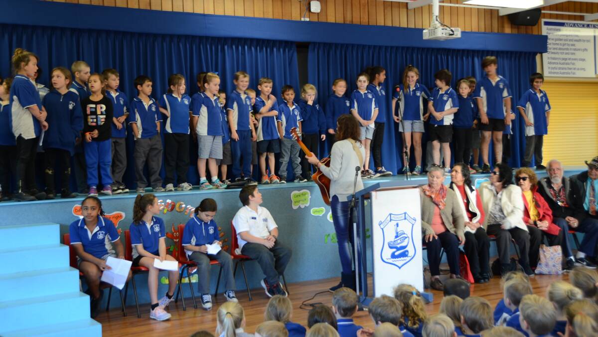 REVIVAL: Chelsy Atkins and the Koori pupils sing their language song at last month’s NAIDOC assembly at Eden Public School.