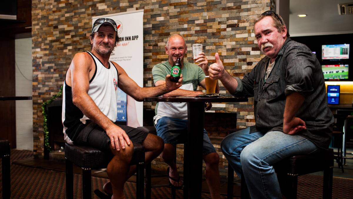 Locals Michael 'Grub' Grubesic, Greg 'Clarky' Clarke and Jason 'Bucko' Buckley cool off at the pub. Picture: Rachel Mounsey