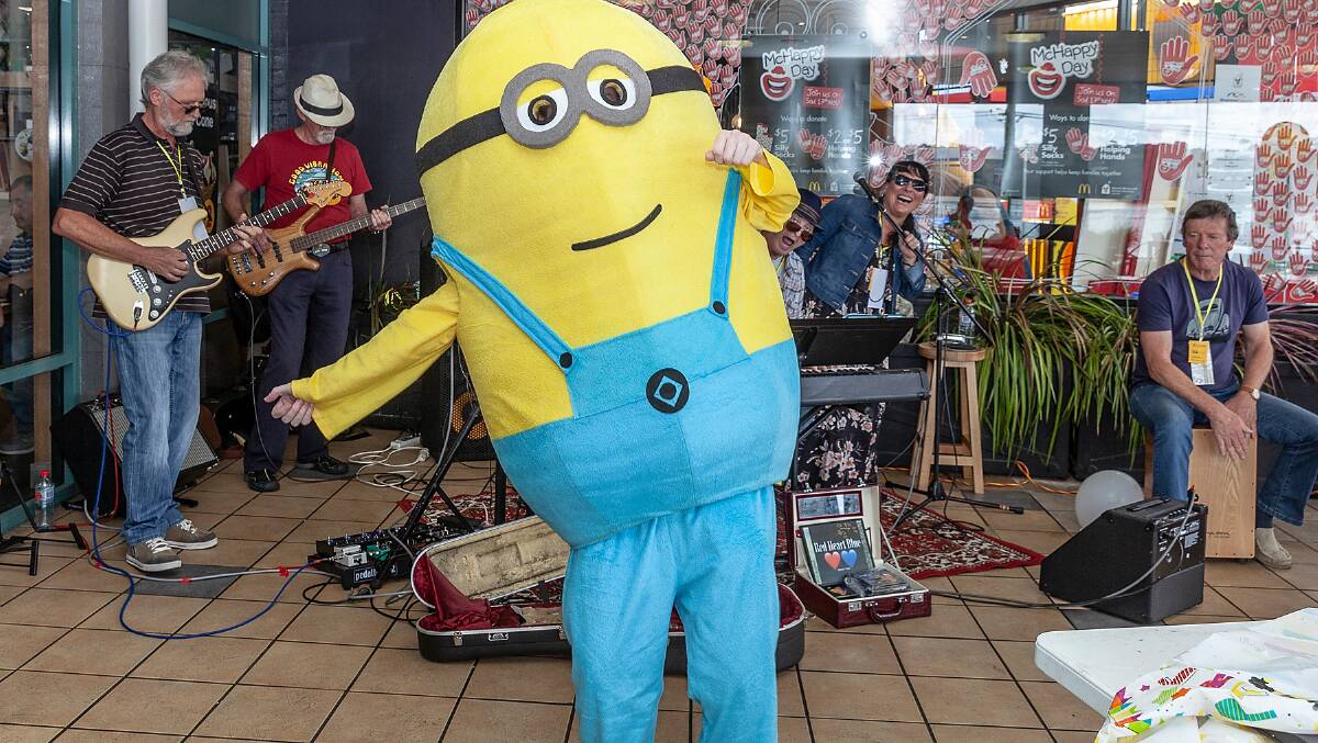 Tim the Minion dances to Eden band Red Heart Blue during the recent McHappy Day festivities in Merimbula. Picture: Phillip Hayson