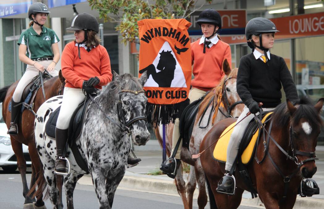 Wyndham Pony Club members join the annual parade along Bega's Carp St as part of the school holiday pony club camp held at the Bega Showground.
