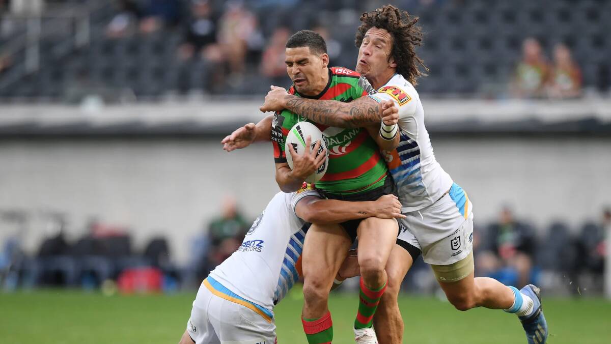 South Sydney's Cody Walker is tackled by two Gold Coast defenders on Saturday. Photo: Rabbitohs Media
