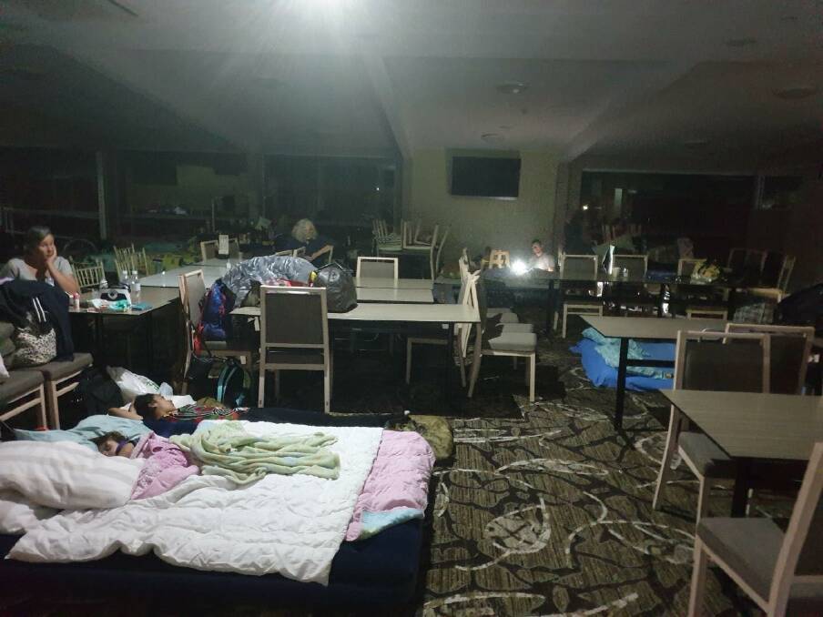 People seek refuge inside Club Narooma when bushfires threatened the town on new Year's Eve. Club Narooma was a secondary evacuation centre established at Narooma. Picture: Tony Casu. 