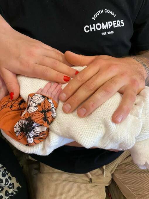 Jenna Lantouris and Charley Alderman hold their baby Kora at Moruya District Hospital. 