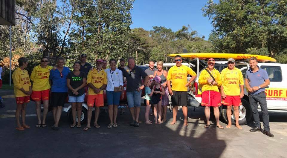 Pambula SLSC members gather as Member for Bega Andrew Constance announces funding for the club. Picture: Supplied.