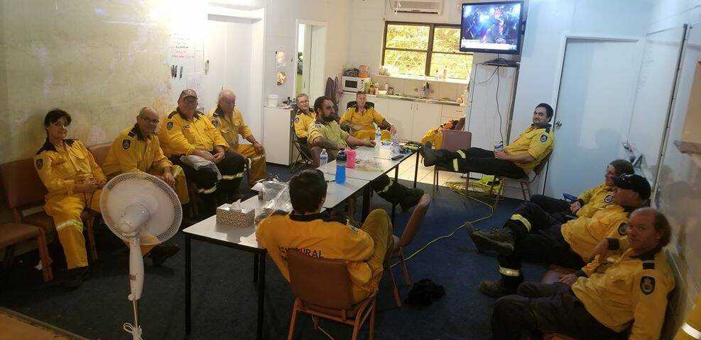 Narooma RFS volunteer firefighters taking a hard-earned break at the station at 2pm on Saturday, February 1.
