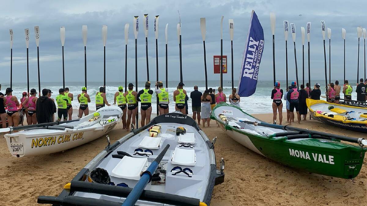 Oars raised at Dee Why beach for a special tribute to sweep Denis Patison. Image: Ocean Thunder Facebook.