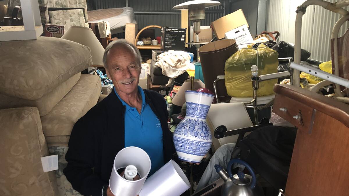 OVERWHELMED: Mick Brosnan from the Social Justice Advocates of the Sapphire Coast looks over the many donated items for this month's Samaritan Op Shop.