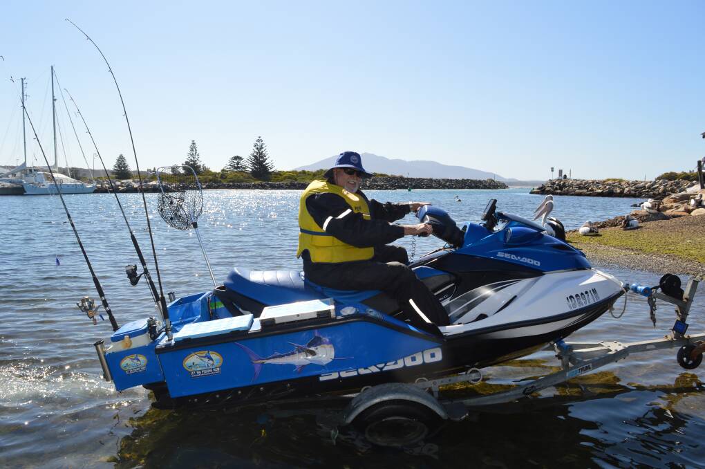 Fun to fish: Eddie Holub launches his jet ski; he invites anyone to come and join in the fun at Bermagui over the long weekend.