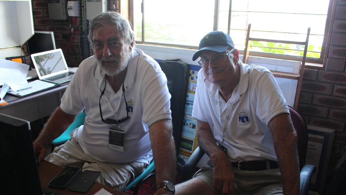 CYCA members Greg Halls and Bill Riley in charge of the Eden communication tower, ensuring all boats have reached a safe point.