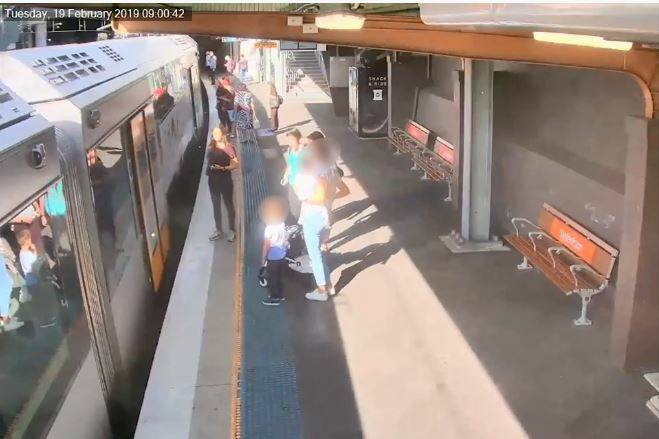 A still from a video released by Transport for NSW where a child falls between the train and the platform. 