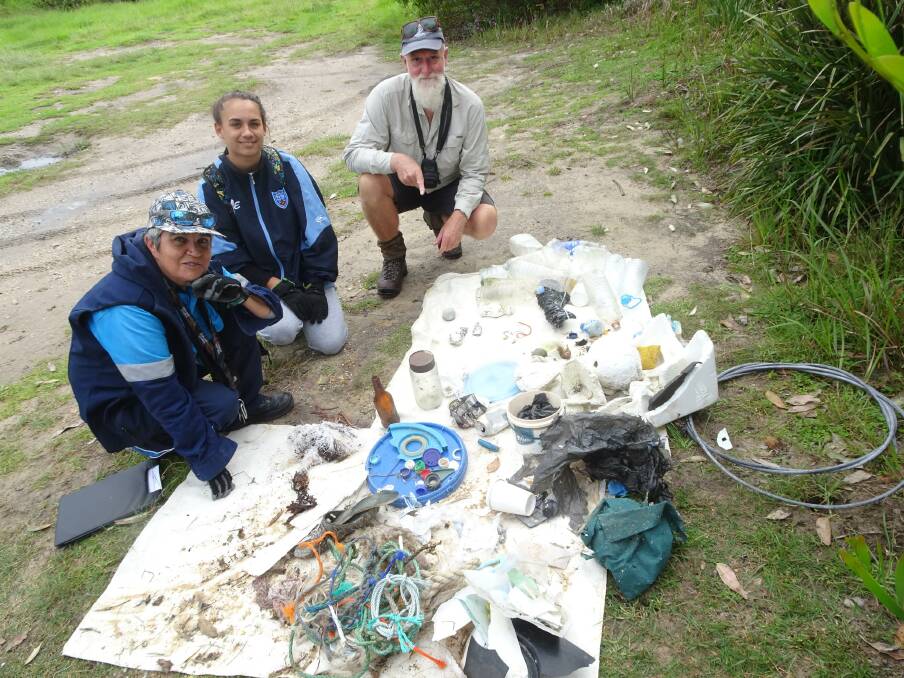 Merrimans Local Aboriginal Land Council members Yuin Kelly and Loanna Panton with Protecting the Wilderness Coast Weeds Project officer Stuart Cameron and the collection from two beaches in Mimosa Rocks National Park.