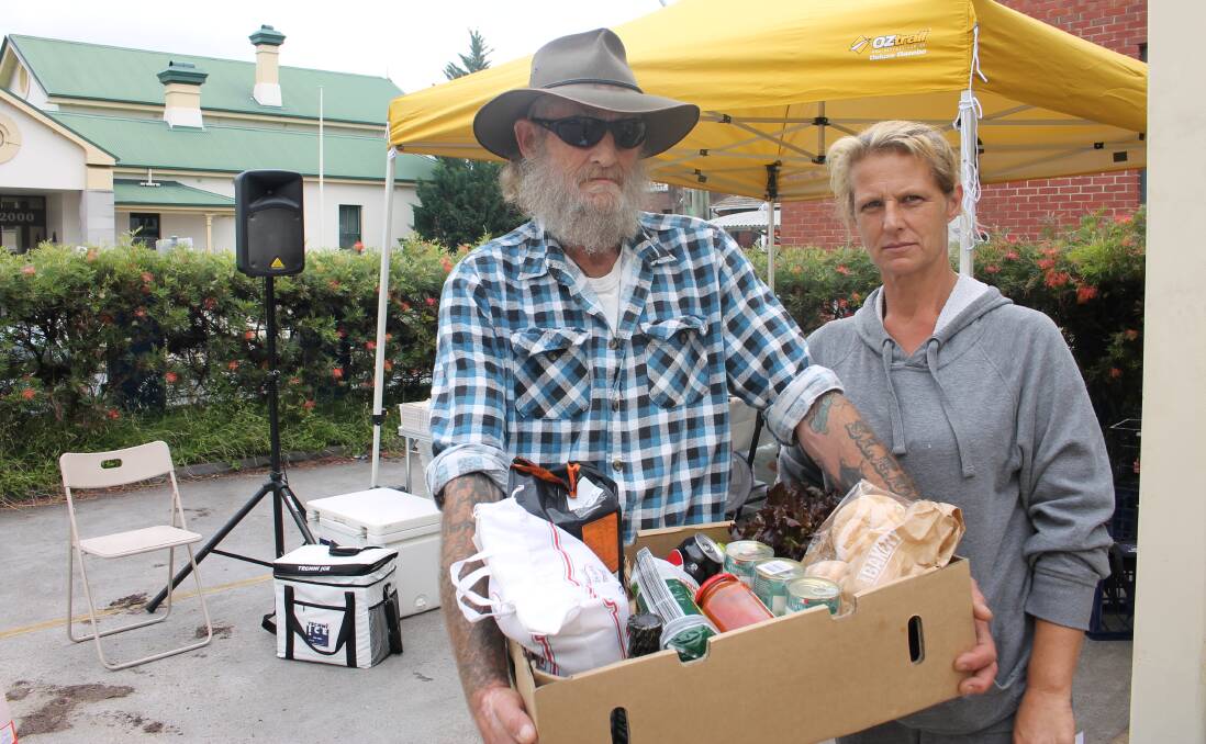 Simon Sledge and Cheryle Russell of Bemboka pick up a week's worth of groceries for just over $10 at the Sapphire Community Pantry. 