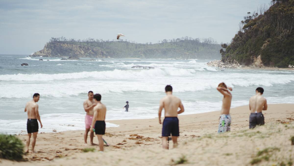 People enjoy the beach at Malua Bay. Picture: Dion Georgopoulos