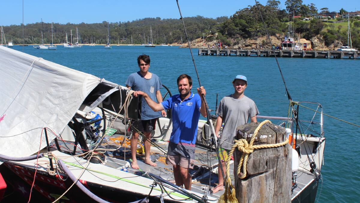 Tassie crew save the day: Gale Force crew members Liam McIntee, Jacob Stanford and Joey Ailing aboard the stricken Hollywood Boulevard after towing it into Eden port.