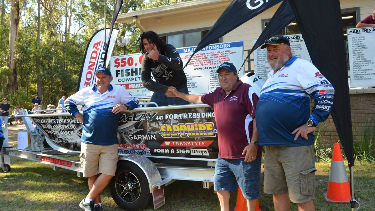 Vice-president of the Eden Amatuer Fishing Club Murray Blyton and president Wayne Holding congratulate the winner of the grand prize, Eden resident Mark Farmer.  Honda territory manager representative Andrew Wenzel (left) announced the winner on Saturday, March 10.