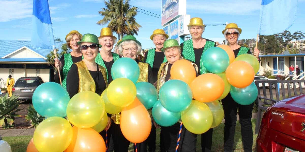 HAPPY FACES: The Pambula-Merimbula CWA members make a colourful splash as they wait for the start of the parade at last year's festival.