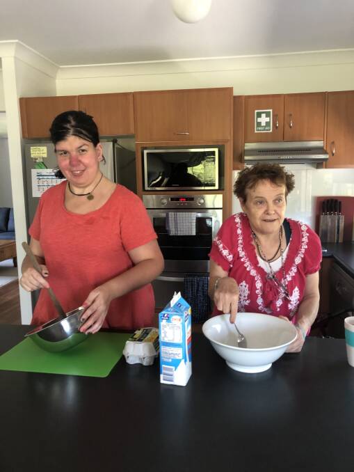 HOUSE MATES: Pippa Blashki and Beth Kelaher cook together in their new home.