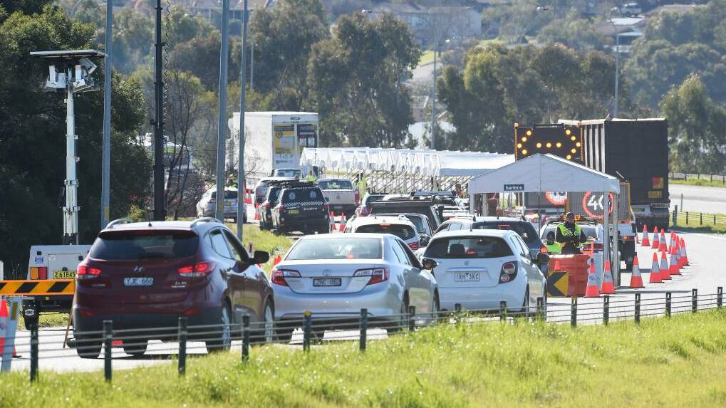 LINE UP: Police and soldiers at the Hume Highway checkpoint in Albury. Picture: Border Mail