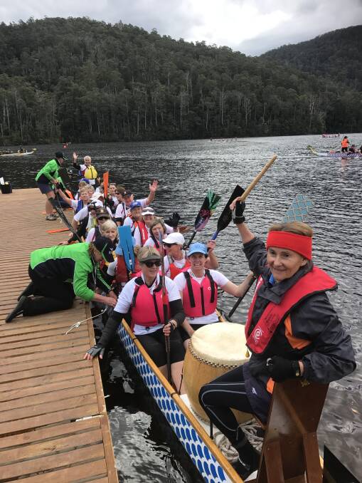 Eileen Quin was beating the drum for this race as the Southern Warriors pull in to the pontoon after racing at Barrington Lake, Tasmania in the Australian Masters Games.