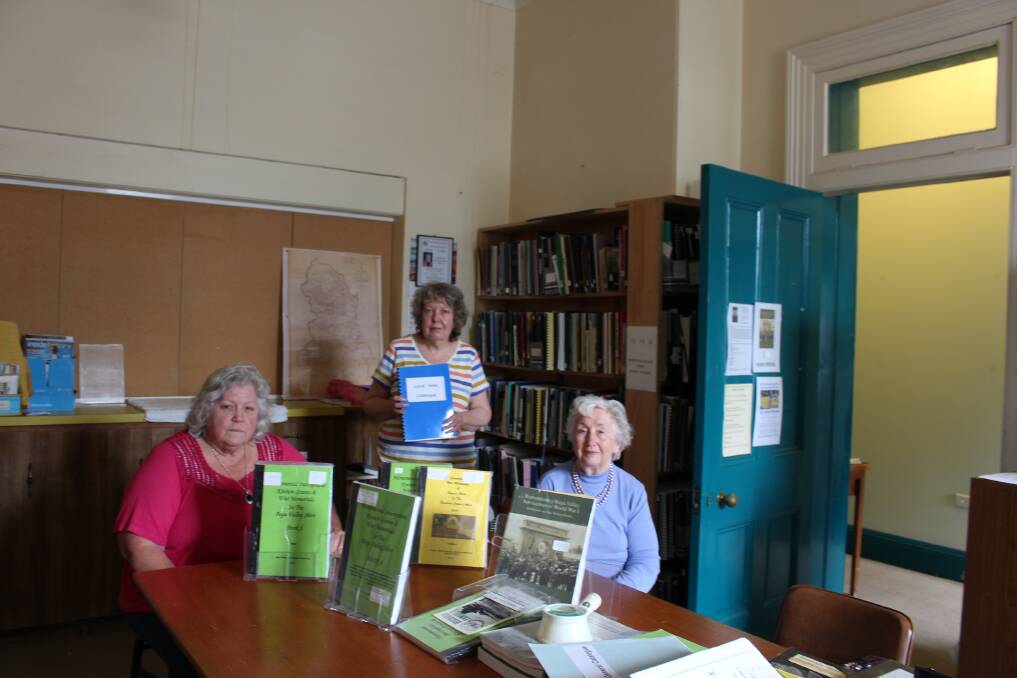 Genealogy Society president Liz McIntyre, treasurer Joan Brown and librarian Ursula Hunt are concerned for the future of the unique collections at Pambula Courthouse.