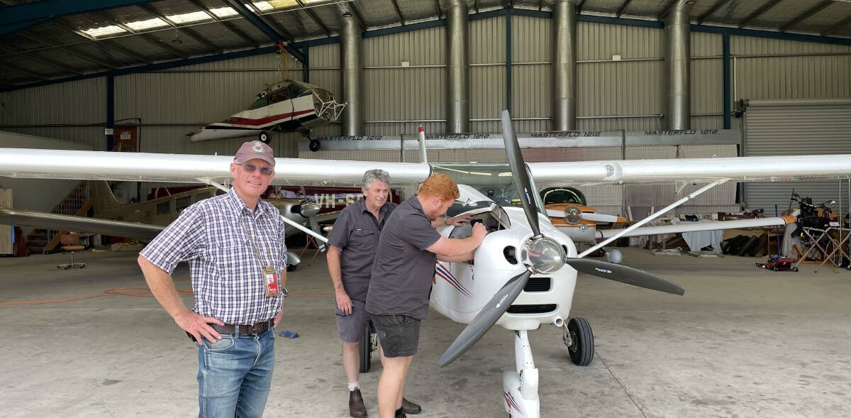 Bushfire pilot Peter Davis seen here with Rex Koerbin and Tom Burn of Merimbula Aircraft Maintenance. Picture by Denise Dion