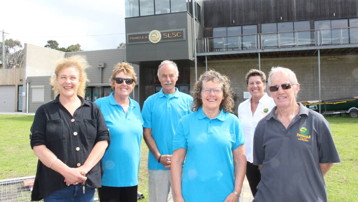 Representatives from Lakeside Electrical, the Social Justice Advocates and Pambula Surf Life Saving Club, which will be the beneficiary of a free solar system.