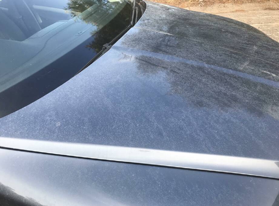 The bonnet of one of the affected vehicles with lime dust streaks visible.