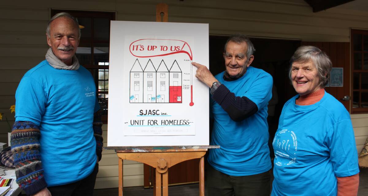 Social Justice Advocates of the Sapphire Coast, Mick Brosnan with Ray and Chris Tynan and the graphic they want to see turn red.