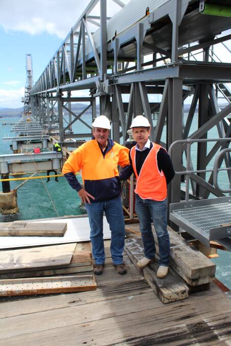 Back in business: Pentarch Forestry regional general manager Kel Henry (left) with Allied Natural Wood Exports general manager Jarrod Wallis at the freshly repaired Eden chip mill conveyor system, Monday November 14. Picture: Toni Houston