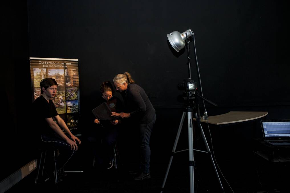 Lights Camera Action : Saarinen organics Kay Saarinen talks students through their lines before filming an advertisement feature.