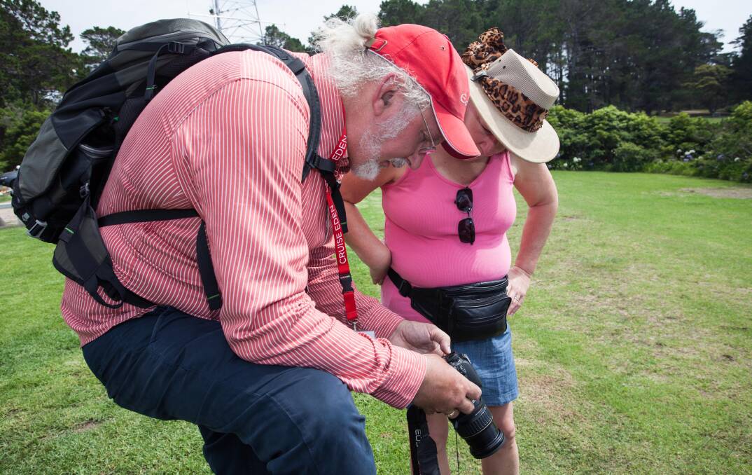 Professional photographer Peter Whiter gives a few tips to a cruise ship tourist participating in 'Picture Perfect Eden' guided tour. Photo: Rachel Mounsey