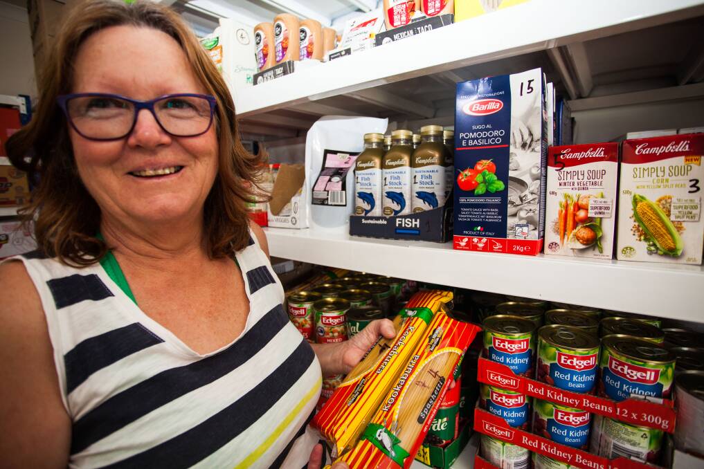 All stocked up and ready to go: Eden Community Pantry volunteer Rhonda Hawke stocks the shelves ahead of the opening. 