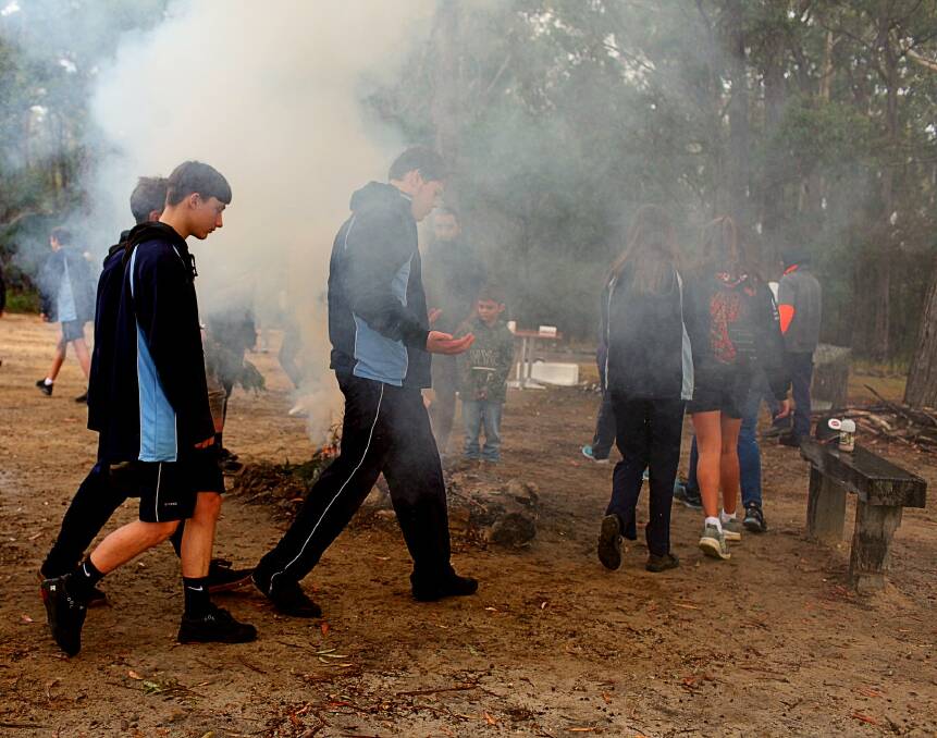 Eden Marine High students take part in the smoking ceremony at the keeping place on Friday. Photo: Rachel Mounsey