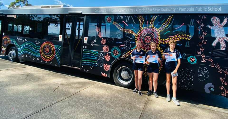 Wrapped: Sapphire Coast Buslines Rich Aboriginal History Theme design winners Amali Alcock, Imogen Osten and Elli Sky Delhunty and the newly unveiled bus with their design. 