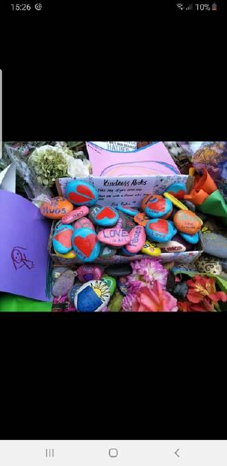 A screen shot picture of "kindness boxes" filled with rocks bearing words of love and encouragement. Photo supplied by Laurelle Burton