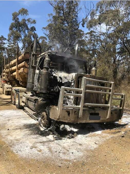 Narrow escape: A driver escaped unharmed after the log truck he was driving along Ben Boyd Road caught fire. Photo: NSW Fire and Rescue Eden 