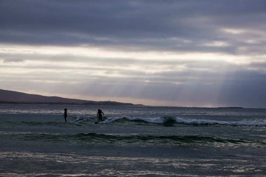 Bastion Point surfers taking advantage of the sand bank Sunday morning. 
