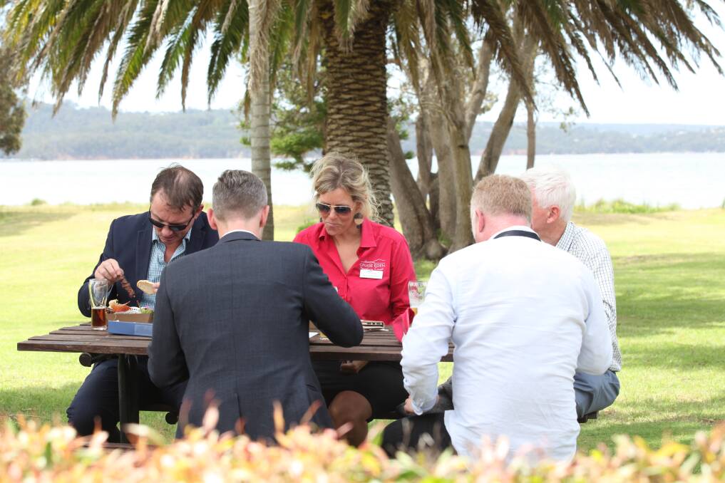 NSW Government representatives sampling some of Eden's finest with Natalie Godward. Picture: Rachel Mounsey