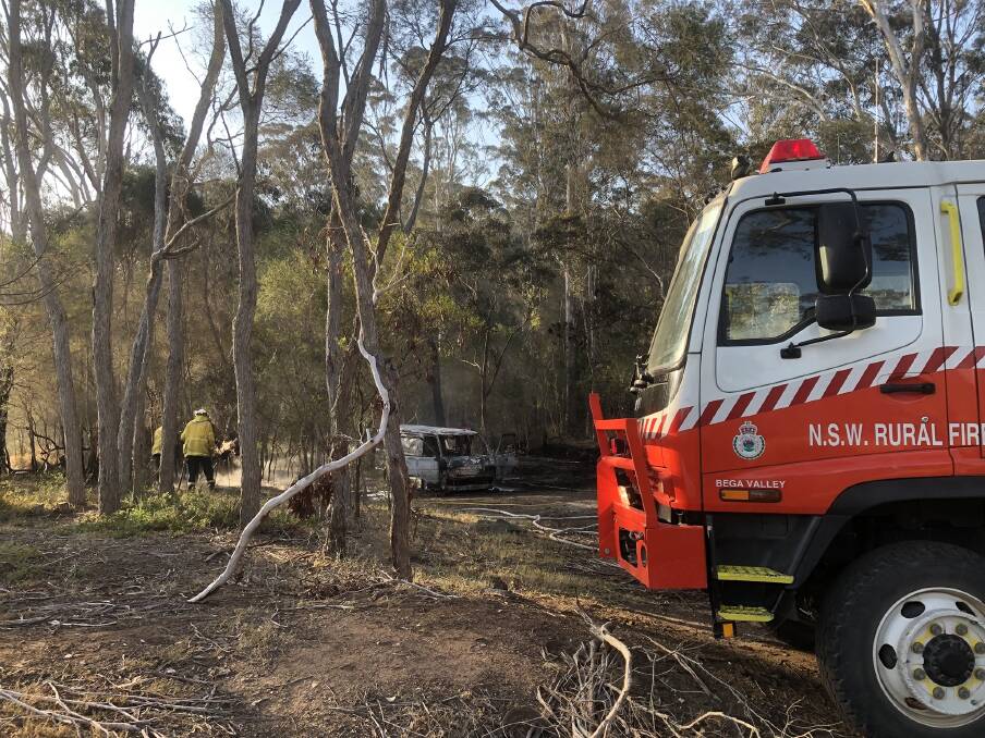 Fire services attend to a fire on Brandy Creek Road on the Nullica River, south of Eden on Saturday. Photo: NSW Fire and Rescue Eden 