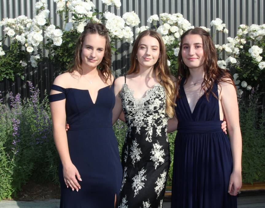 Fine style : Emma Webster, Jade Matthews and Thea Luimes arrive at Eden Marine High School Formal. Photo : Rachel Mounsey