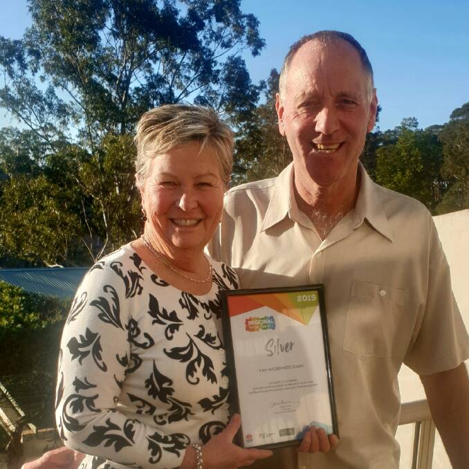 Jenny and Arthur Robb from Kiah Wilderness Tours hold up their silver award. Photo: supplied