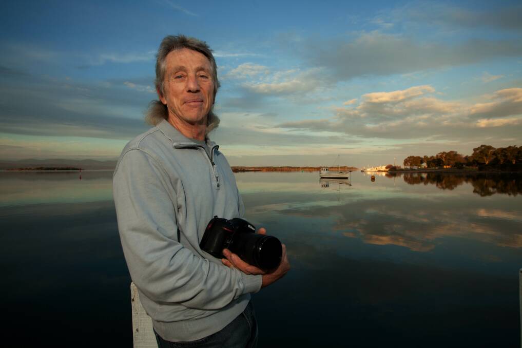 A cool view : Photographer Martin Ascher keeps his eye on the sky at Coulls Inlet. Just one of his favourite locations for his calendar shots. Photo: Rachel Mounsey