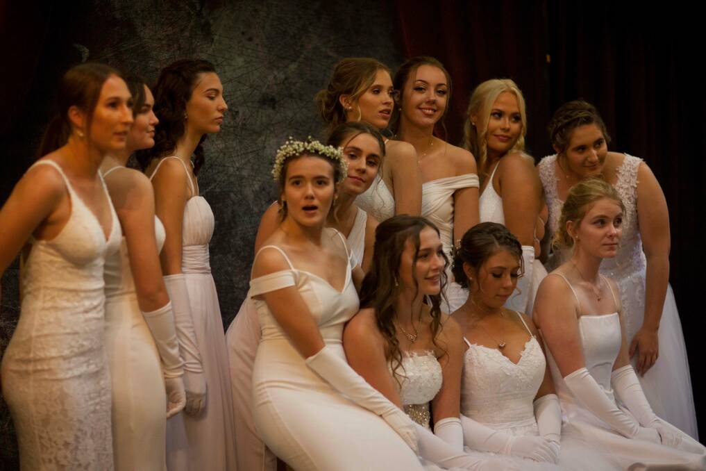 A moment captured: Twelve of the 15 debutantes pose for a group photo ahead of making their debut. Photo: Rachel Mounsey
