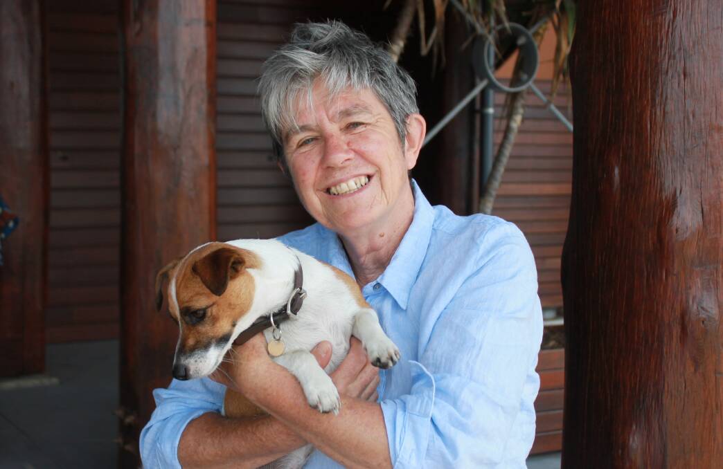 LIFE-LONG ADVOCATE: Ludo McFerran, pictured with her dog Sadie in Bermagui, has worked in the field of domestic violence support and strategy for 40 years.