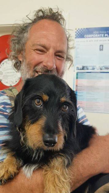 The man and Chewie after being rescued on Thursday. Image: NSW Police 