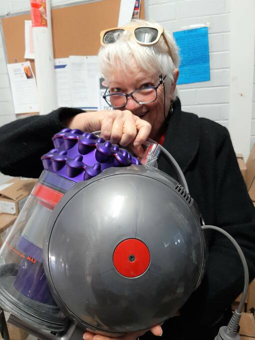 LONG ROAD TO RECOVERY: Bega Valley bushfire-affected resident Caroline Long holds a Dyson vacuum that was donated to her. Picture: Supplied 