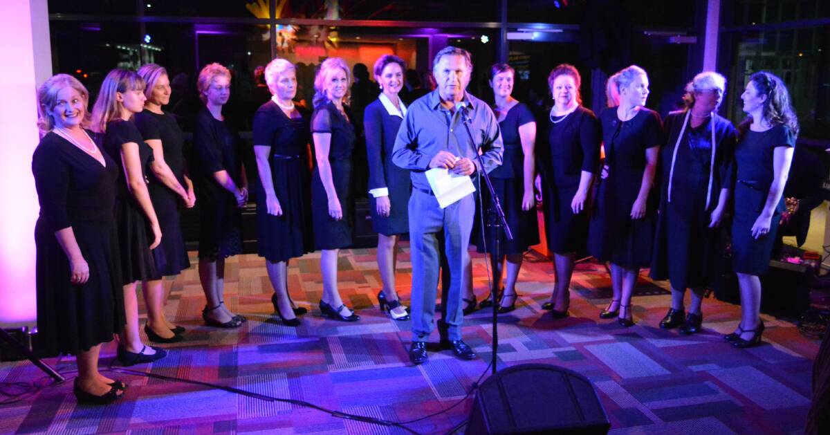 MUSICAL SPECTACULAR: A group of the Ladies in Black cast attend the launch of the production in Bega last month with director Frankie J Holden. 