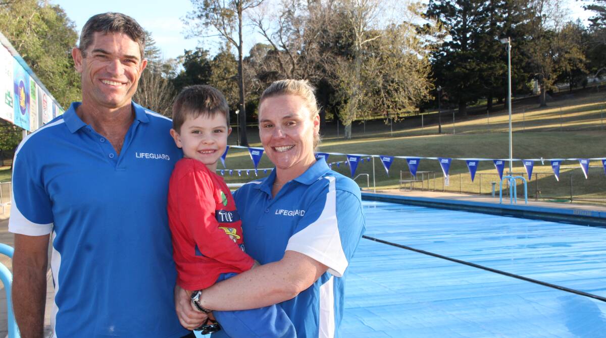 WATER IS WARM: Pool managers Mark and Zoe Philipzen stand next to the 26 degree Celsius Bega pool with their son Henry. 