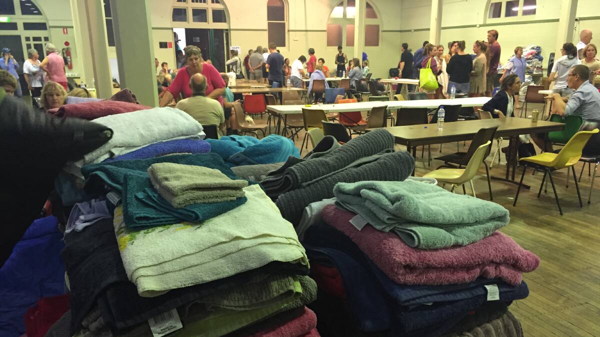 Donations of towels and blankets pour into the Bega Evac Centre at the town's showground after the bushfire in Tathra's region in 2018. 